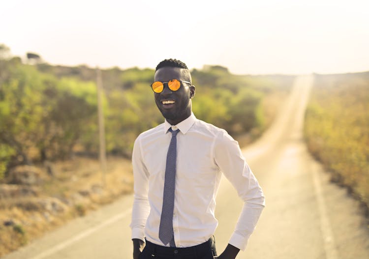 Happy Man In Formal Wear And Glasses In Countryside