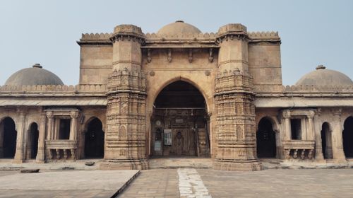 Free Detailed view of the intricate stone carvings on an ancient mosque in Ahmedabad, India. Stock Photo