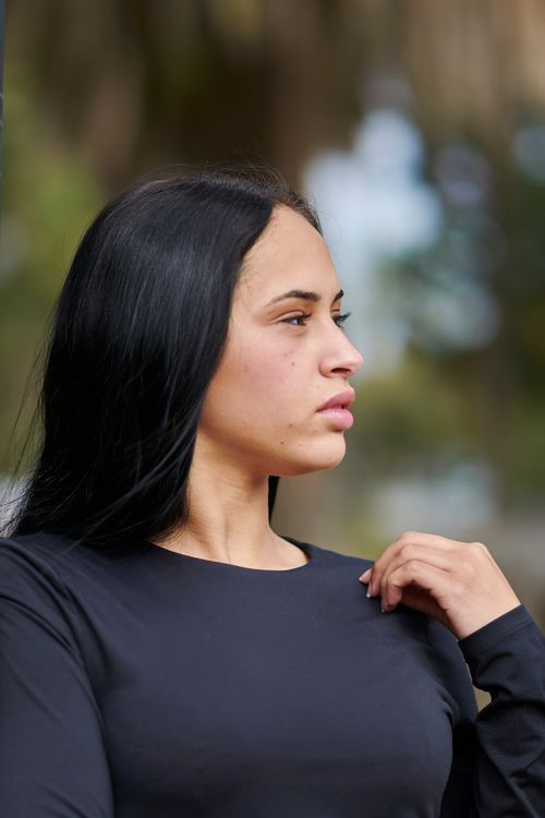 Free A thoughtful woman gazes into the distance in an outdoor setting in Uruguay. Stock Photo