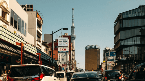 Free Bustling Tokyo street with the iconic Skytree and modern architecture. Daytime urban activity. Stock Photo