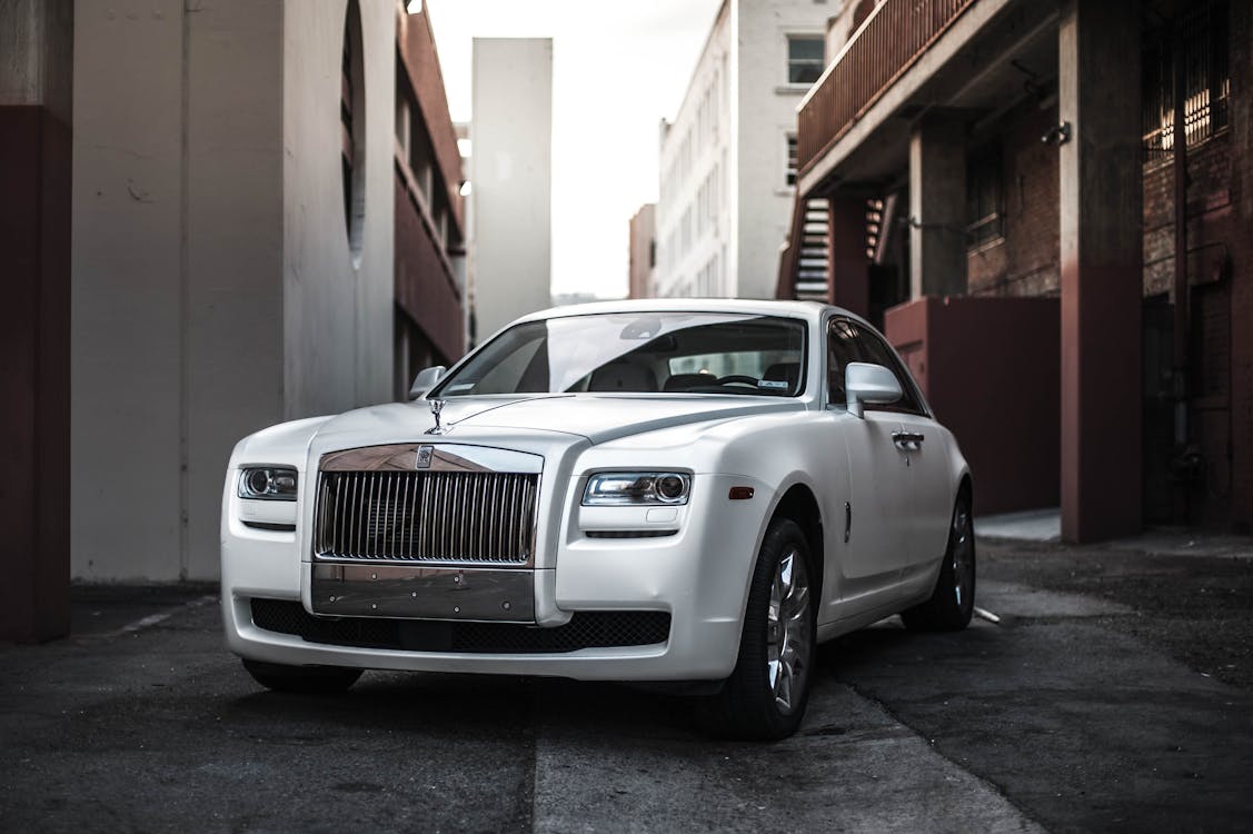 Photo of White Rolls Royce Ghost Parked in an Alley