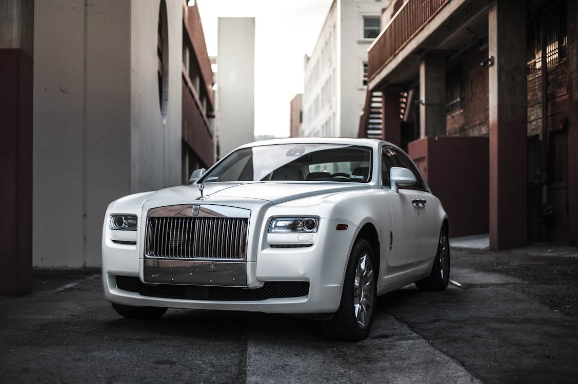 Free Photo of White Rolls Royce Ghost Parked in an Alley Stock Photo