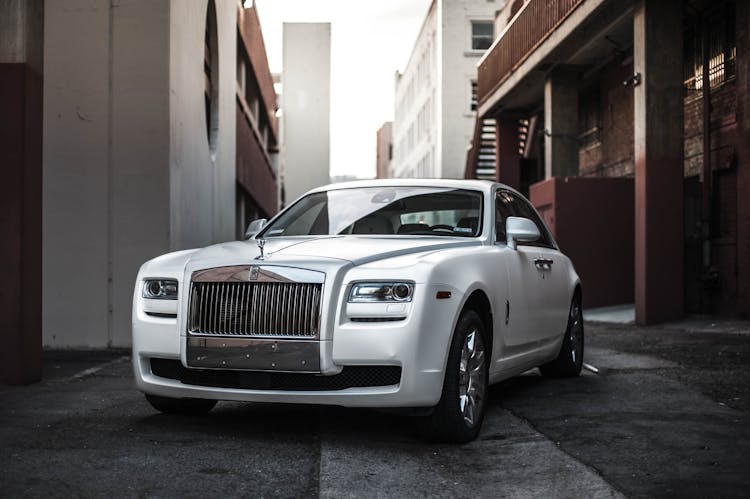 Photo Of White Rolls Royce Ghost Parked In An Alley