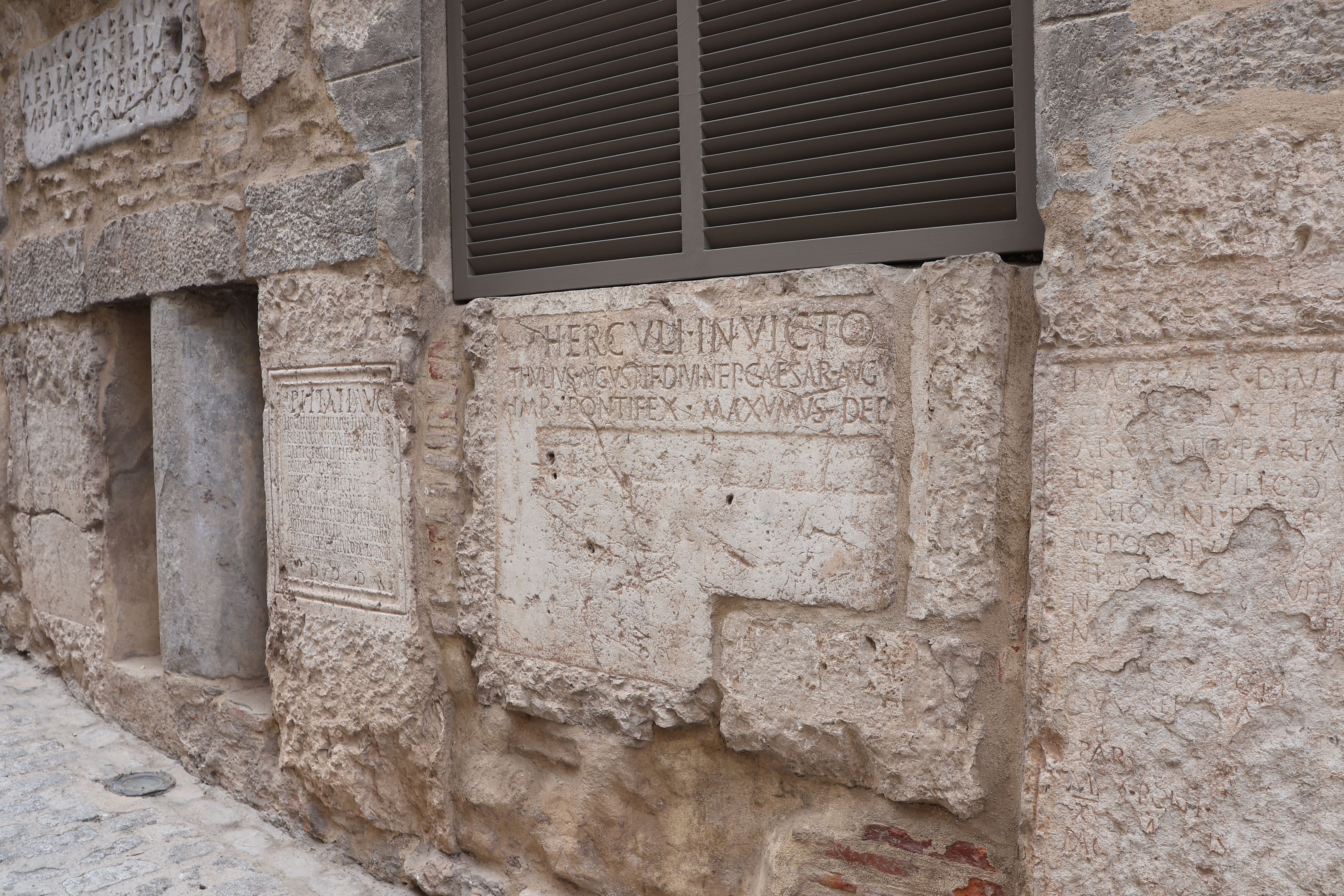 Ancient Stone Inscription on Historic Wall · Free Stock Photo