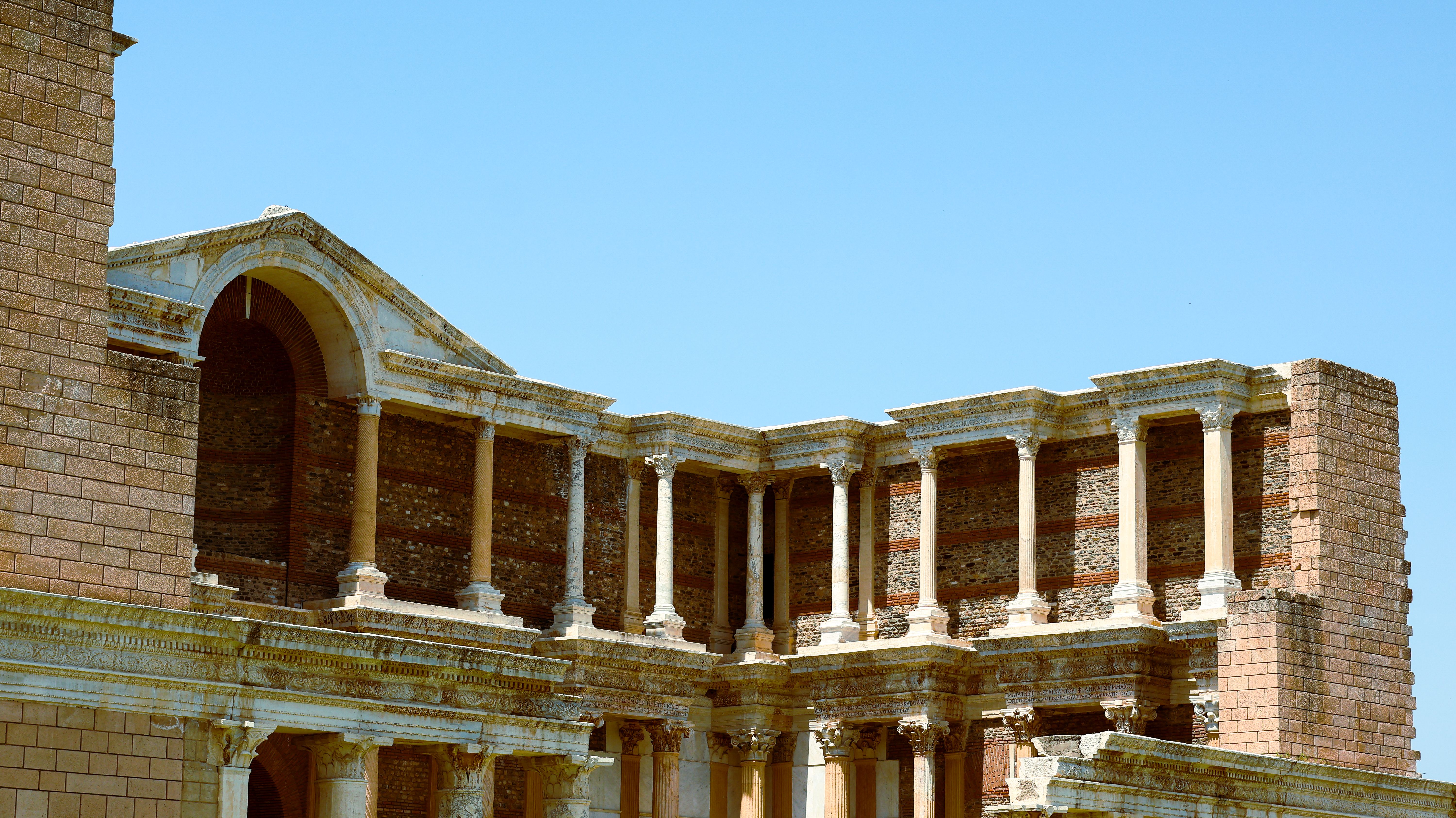 Ancient Roman Ruins with Columns Under Blue Sky · Free Stock Photo