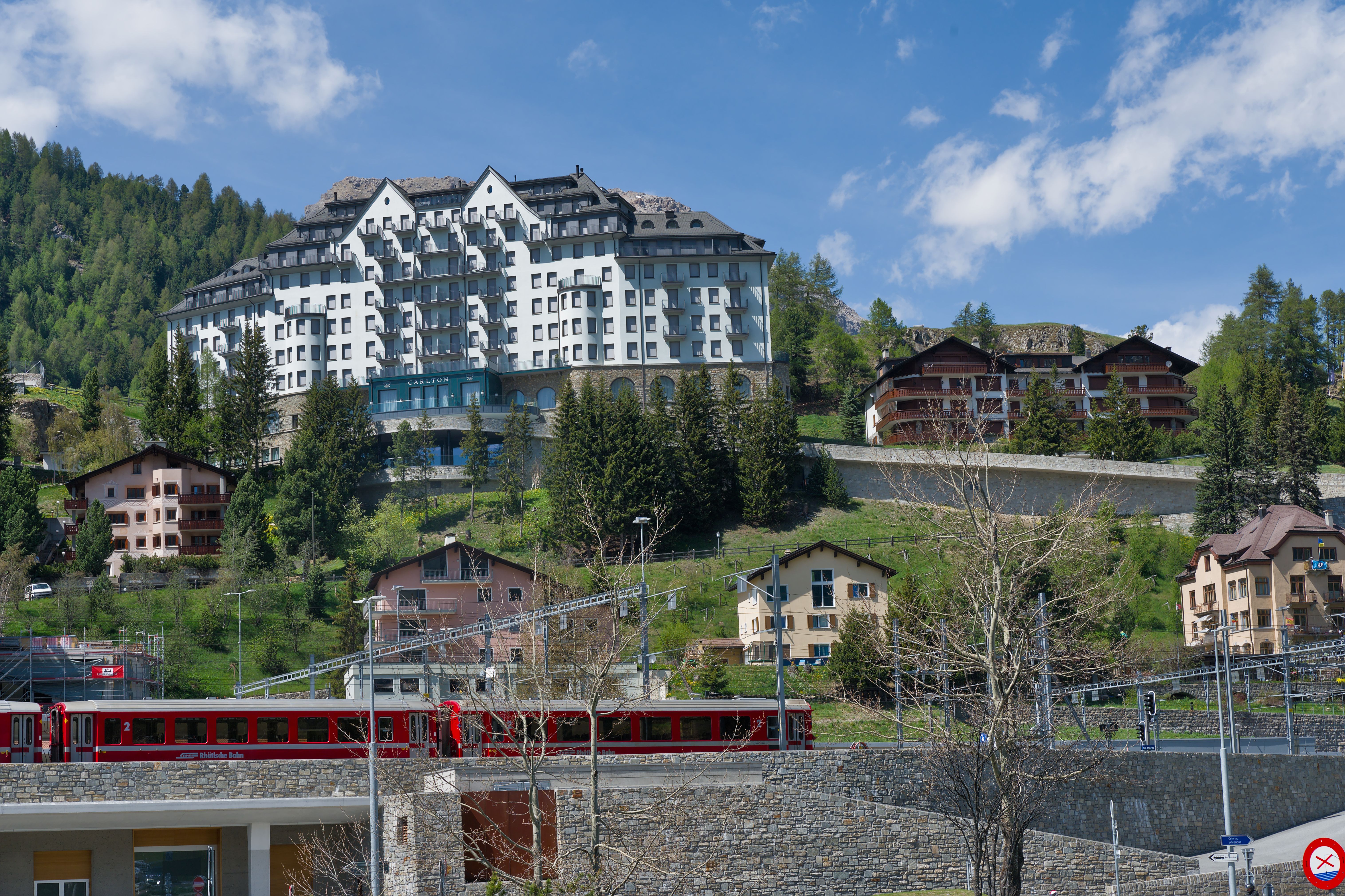 A sophisticated view of a luxury train cabin or a high-end hotel suite overlooking a global city.