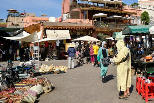 Free Lively street market in Marrakesh, Morocco, capturing local culture and daily life. Stock Photo