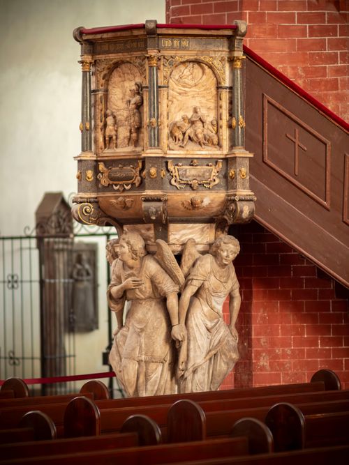 Free Intricately carved stone pulpit in a beautiful Polish church highlighting religious art. Stock Photo