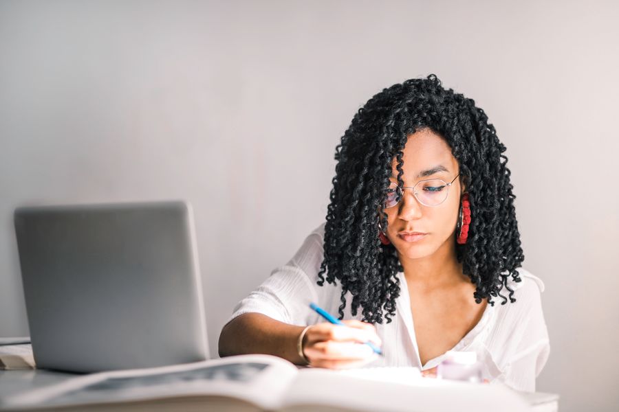A young student studying at her desk