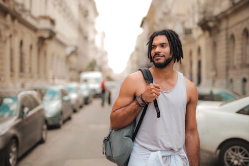 Man Walking Beside Parked Cars