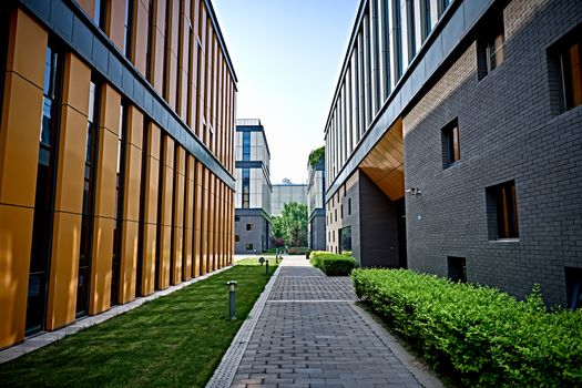 Vibrant view of modern office buildings with pathway and greenery.