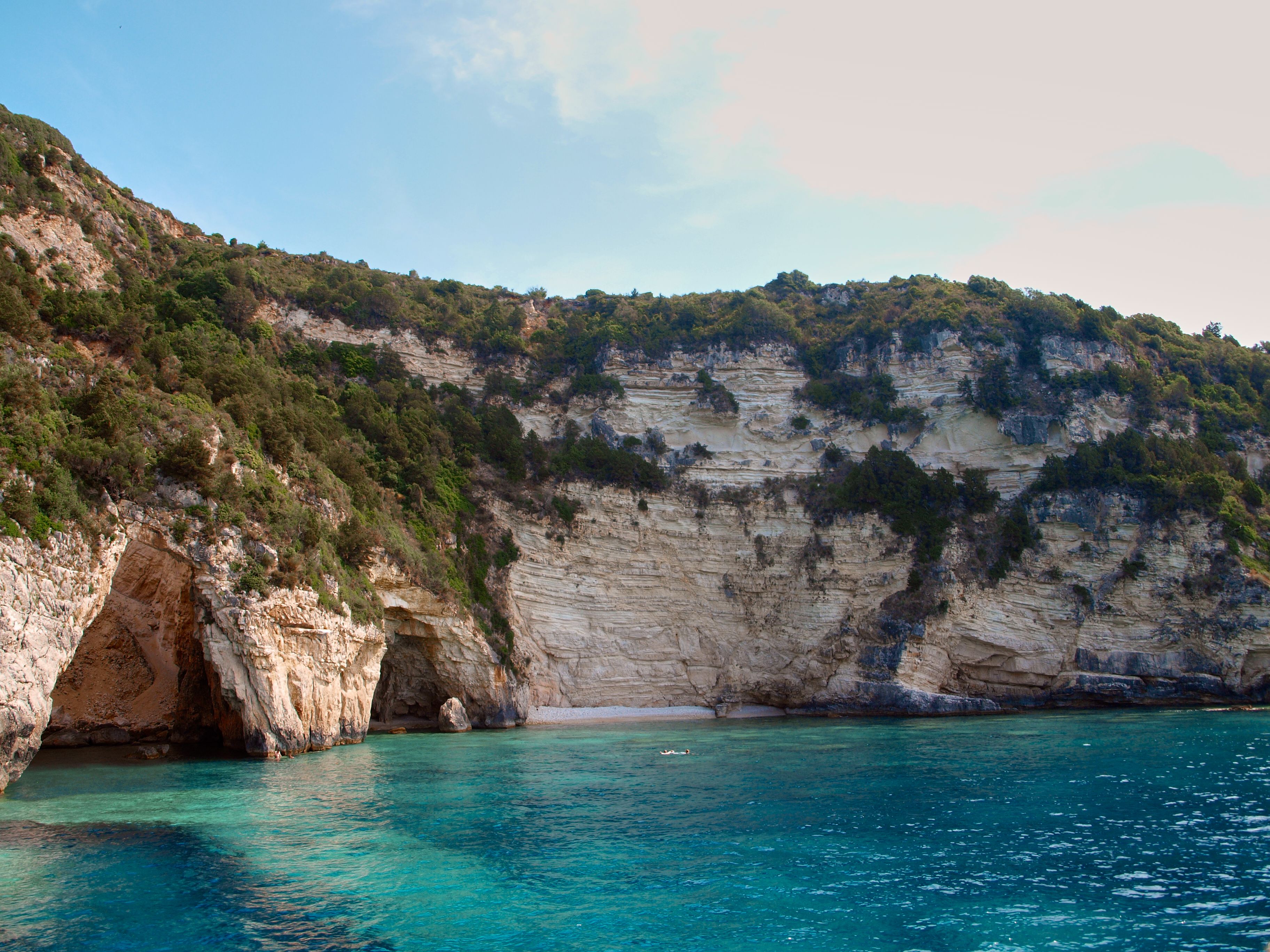 Discover serene coastal cliffs and turquoise waters in Antipaxos, Greece. - Photo by Nils Rotura on Pexels