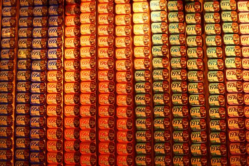 Free Vibrant display of sardine cans with various years, creating a vintage aesthetic. Stock Photo