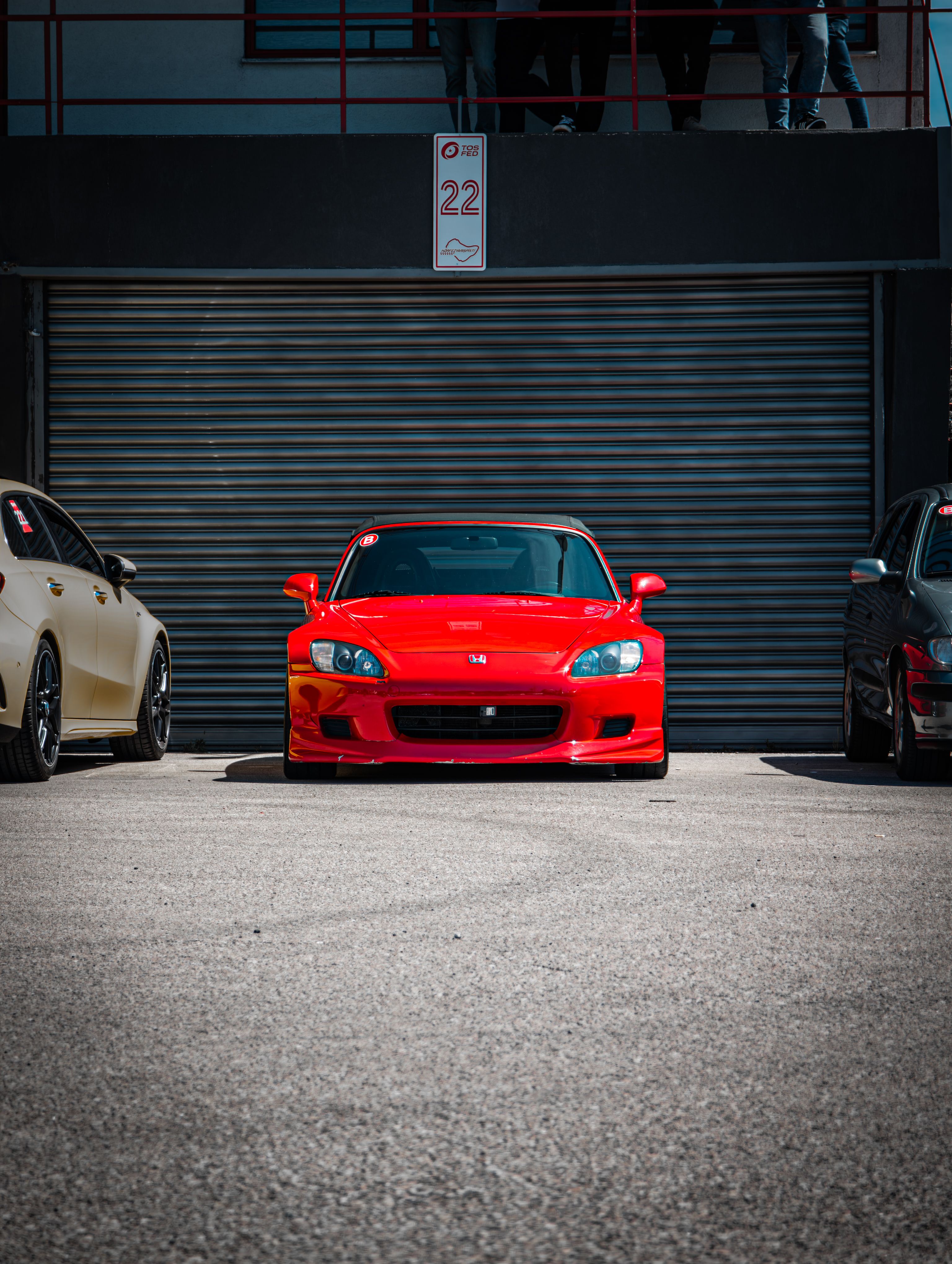Man Driving a Red Car · Free Stock Photo