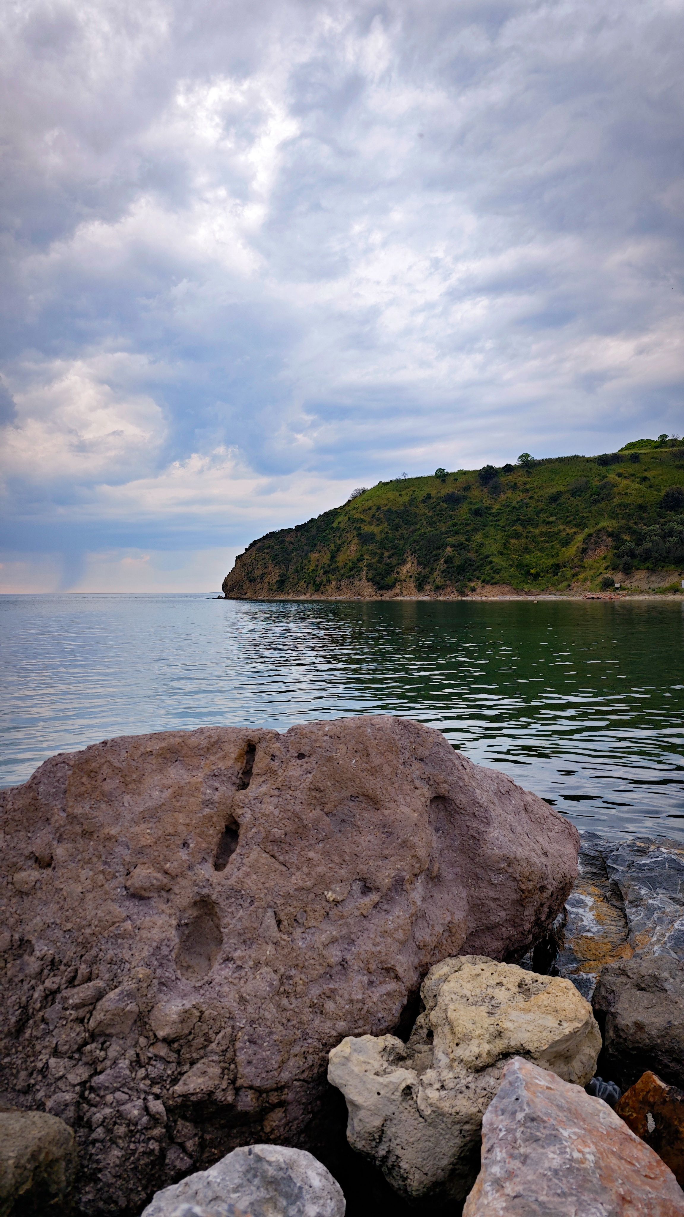 Scenic Rocky Coastline with Cloudy Sky · Free Stock Photo