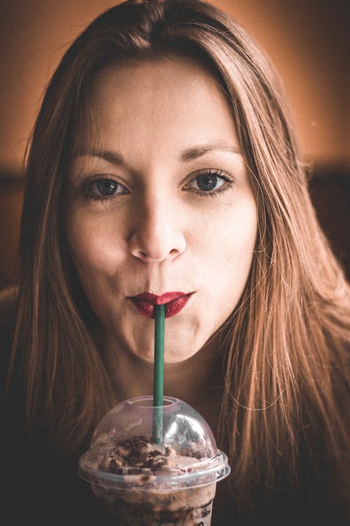 Woman in Red Lipstick Sipping Ice Blended Coffee