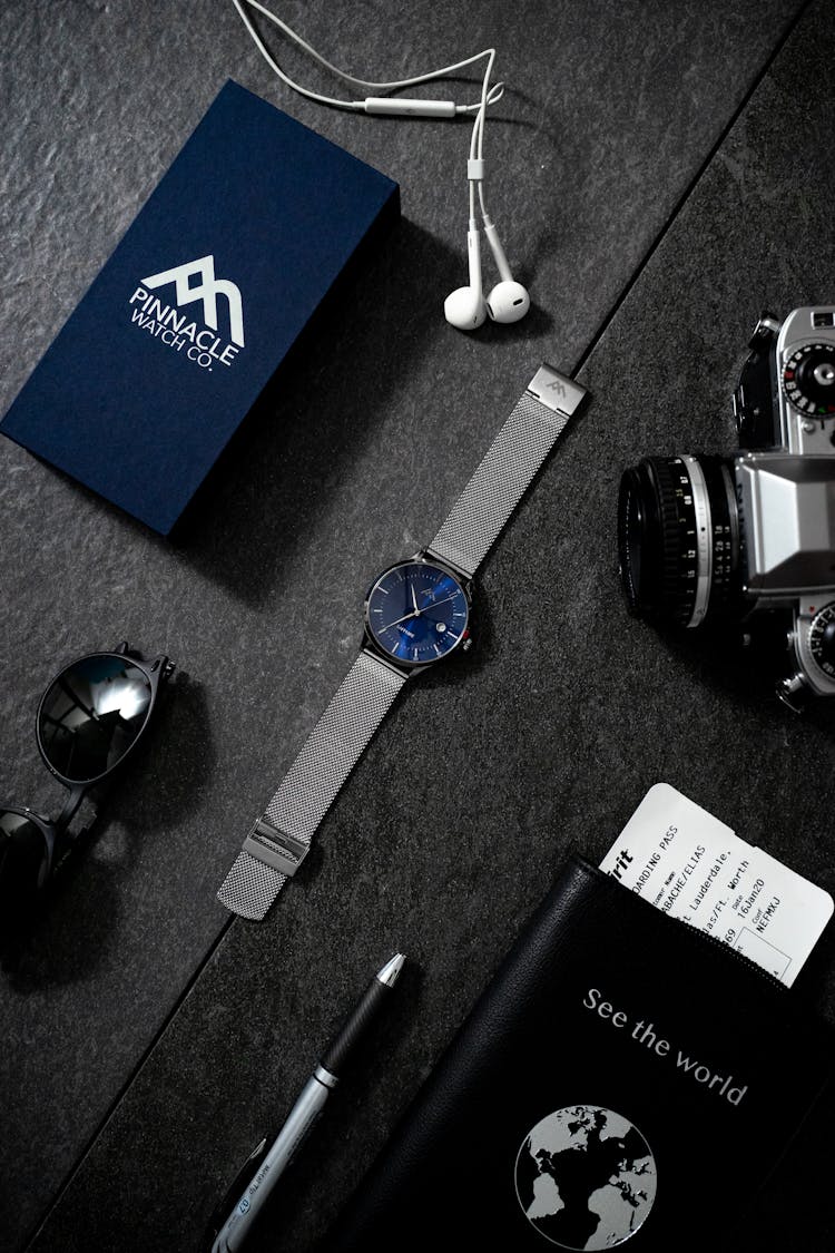 Sapphire Analog Watch Beside Analog Camera