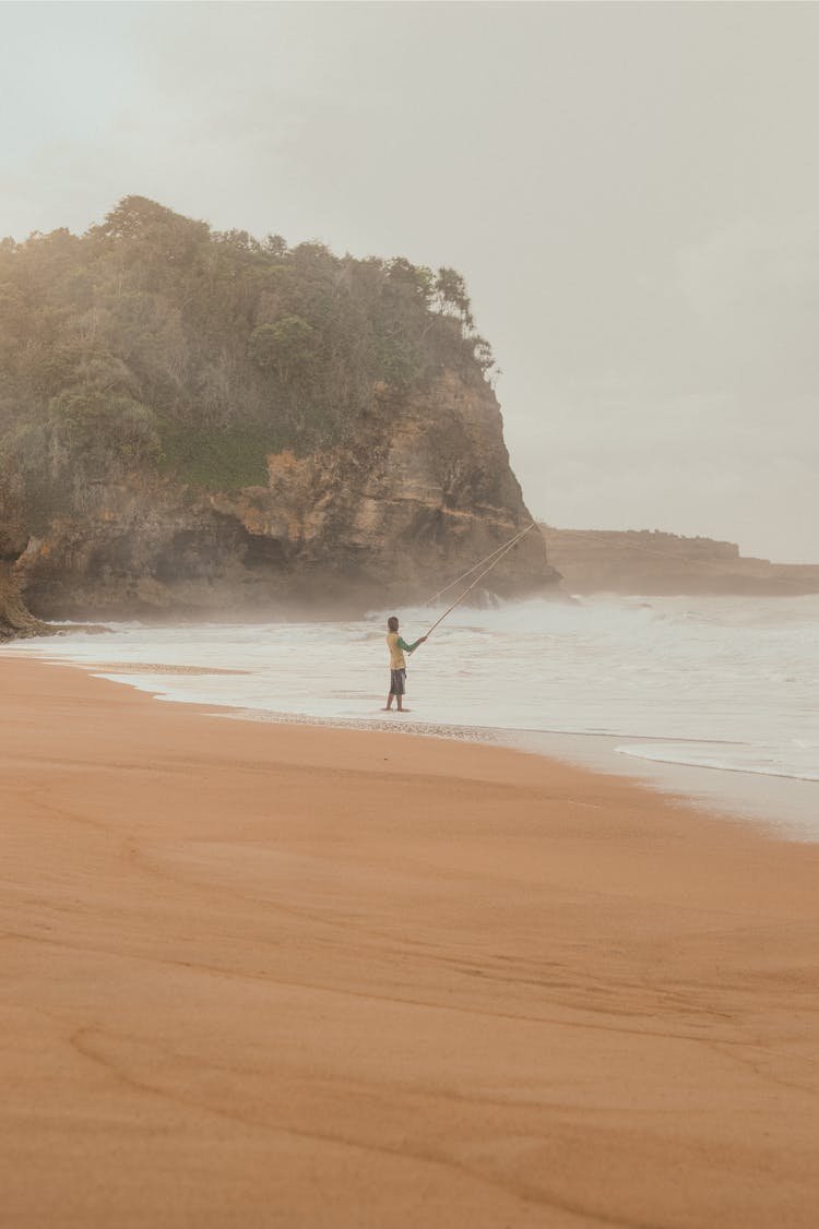 Person Catching Fish On The Island