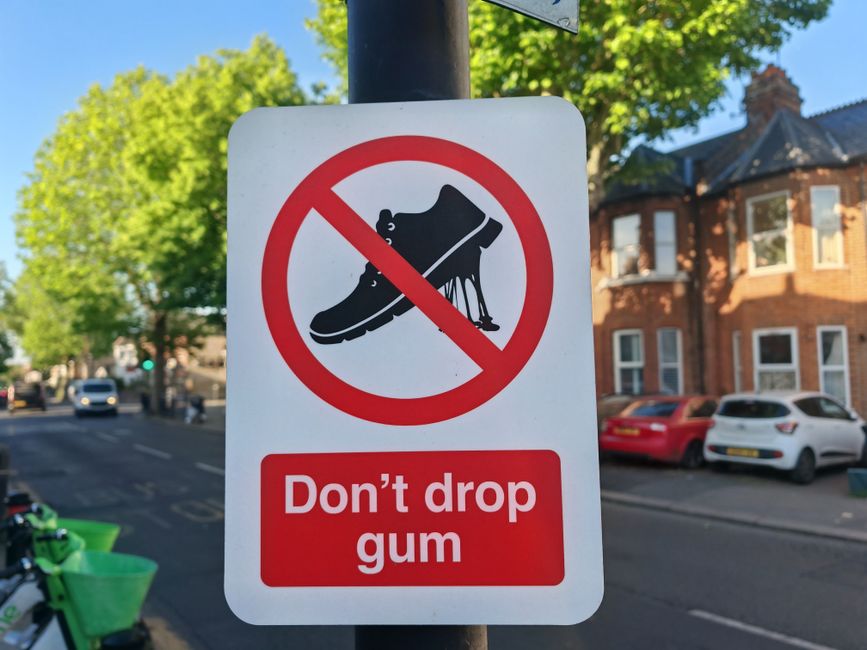 A street sign in London, UK, warning pedestrians against dropping gum. Captured in a residential area.