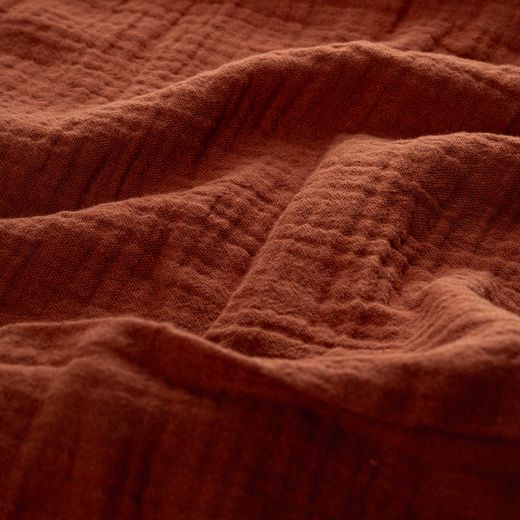 Warm autumn-toned muslin cloth in soft folds — photo by ALOK DAS on Pexels