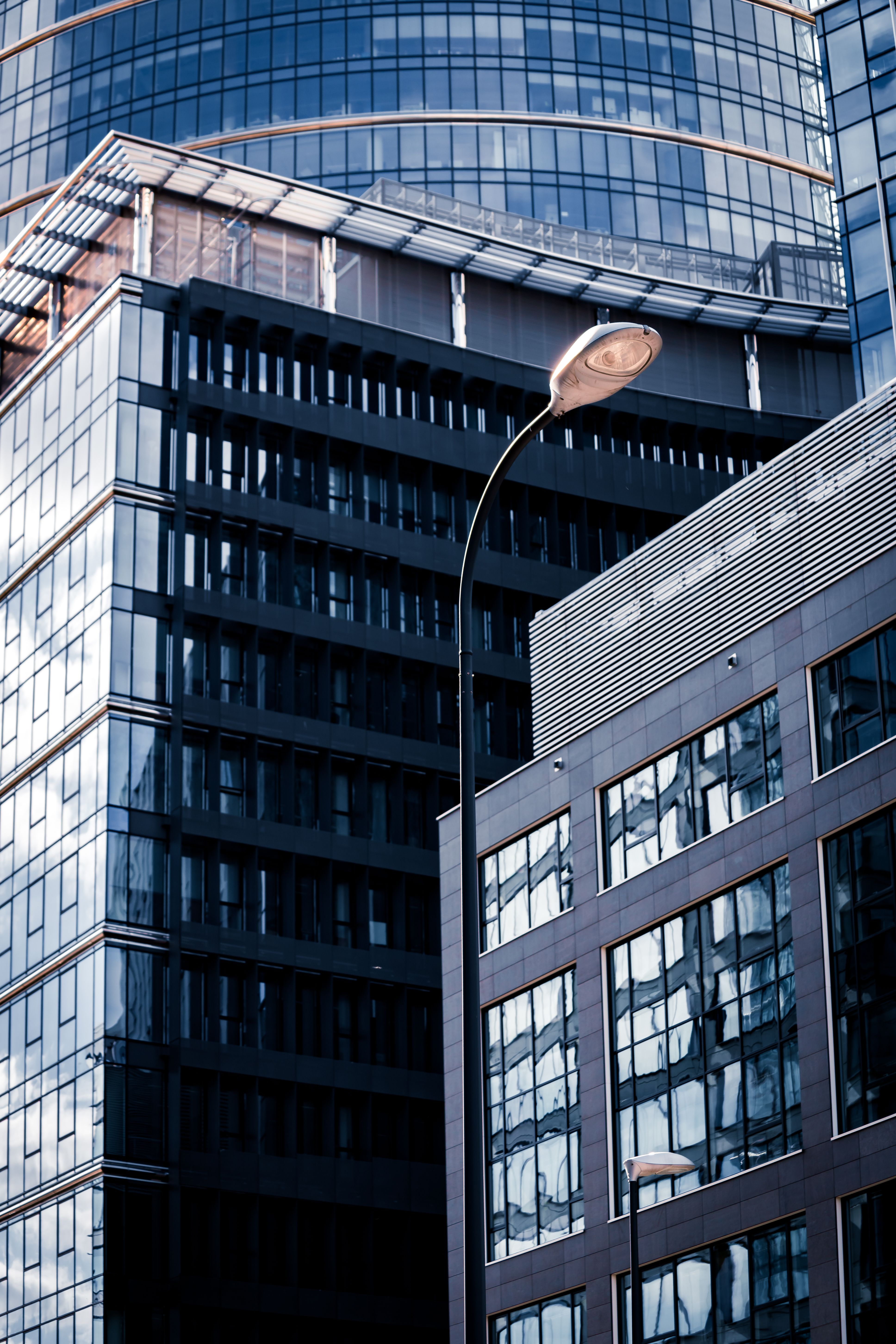 Contemporary high-rise buildings with glass facades in the heart of Warsaw, Poland.