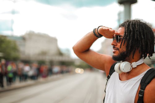 Man in White T-shirt Wearing Black Sunglasses