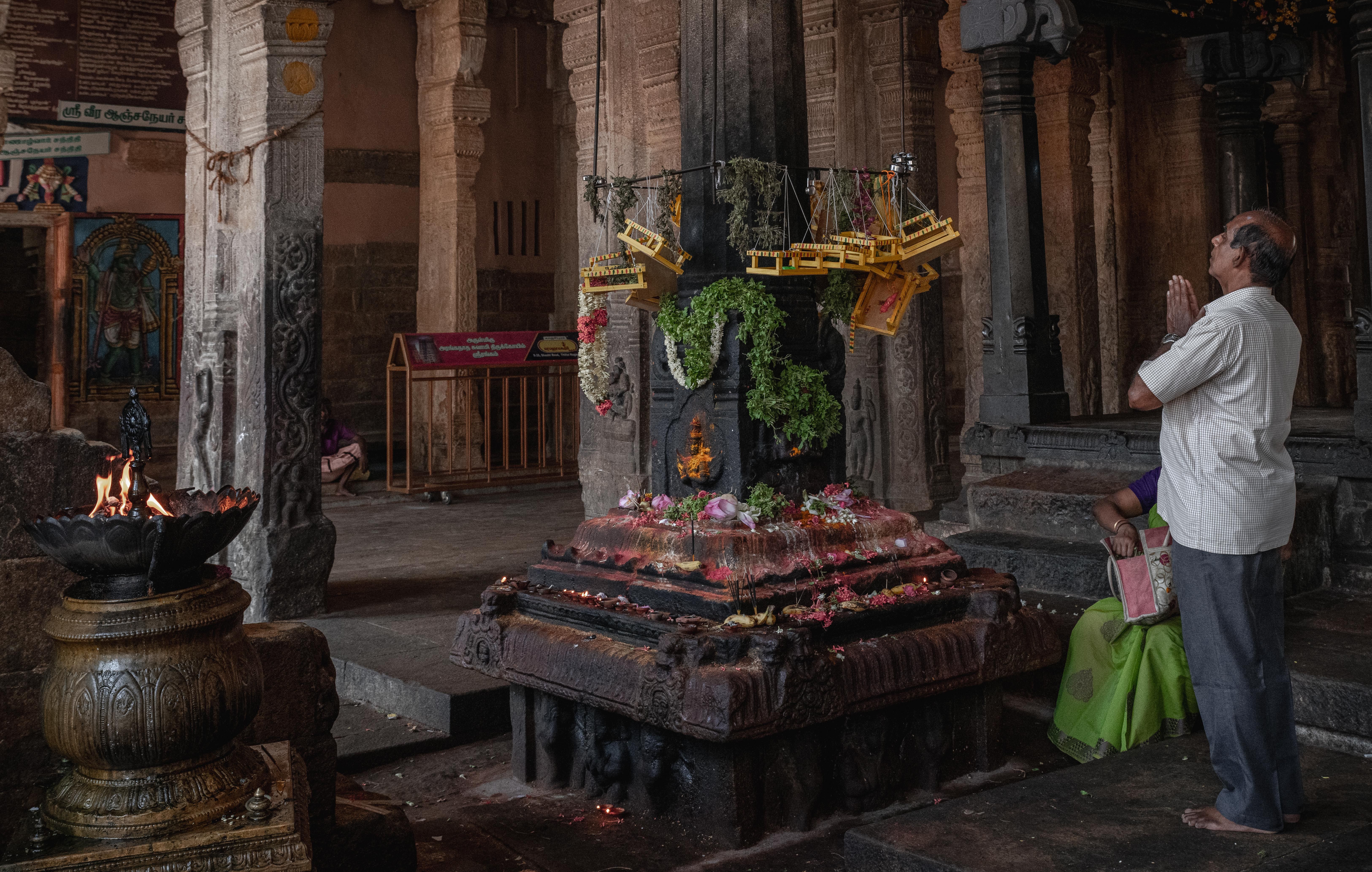 Temple interior with soft lights and devotees