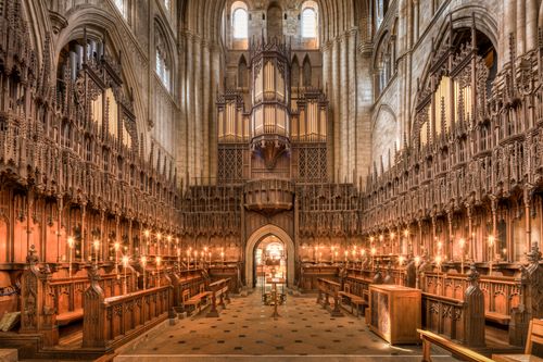 Free Majestic Gothic architecture of Ripon Cathedral's quire with detailed woodwork and stunning pipe organ. Stock Photo