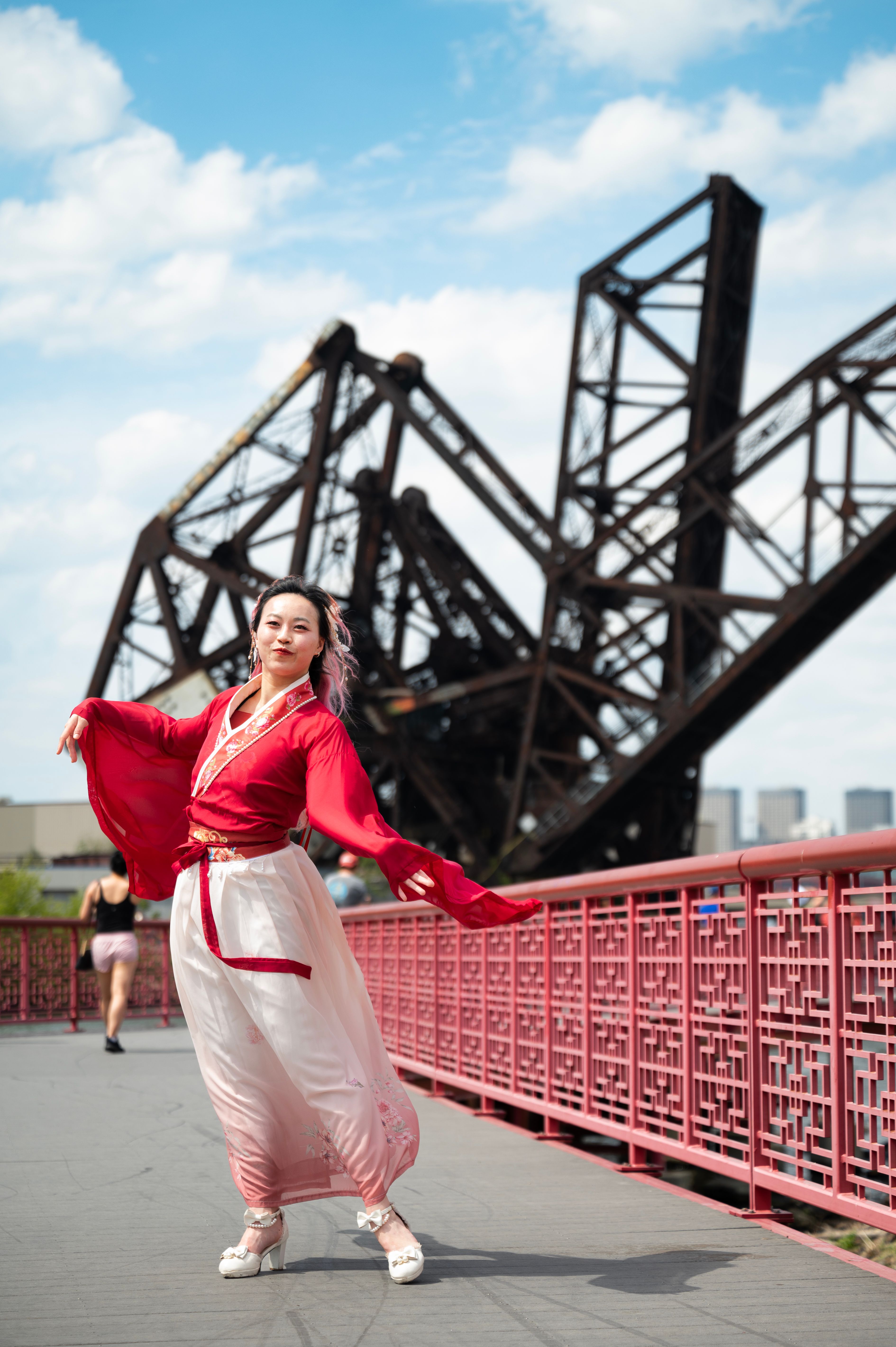Woman in Traditional Attire on Red Bridge · Free Stock Photo