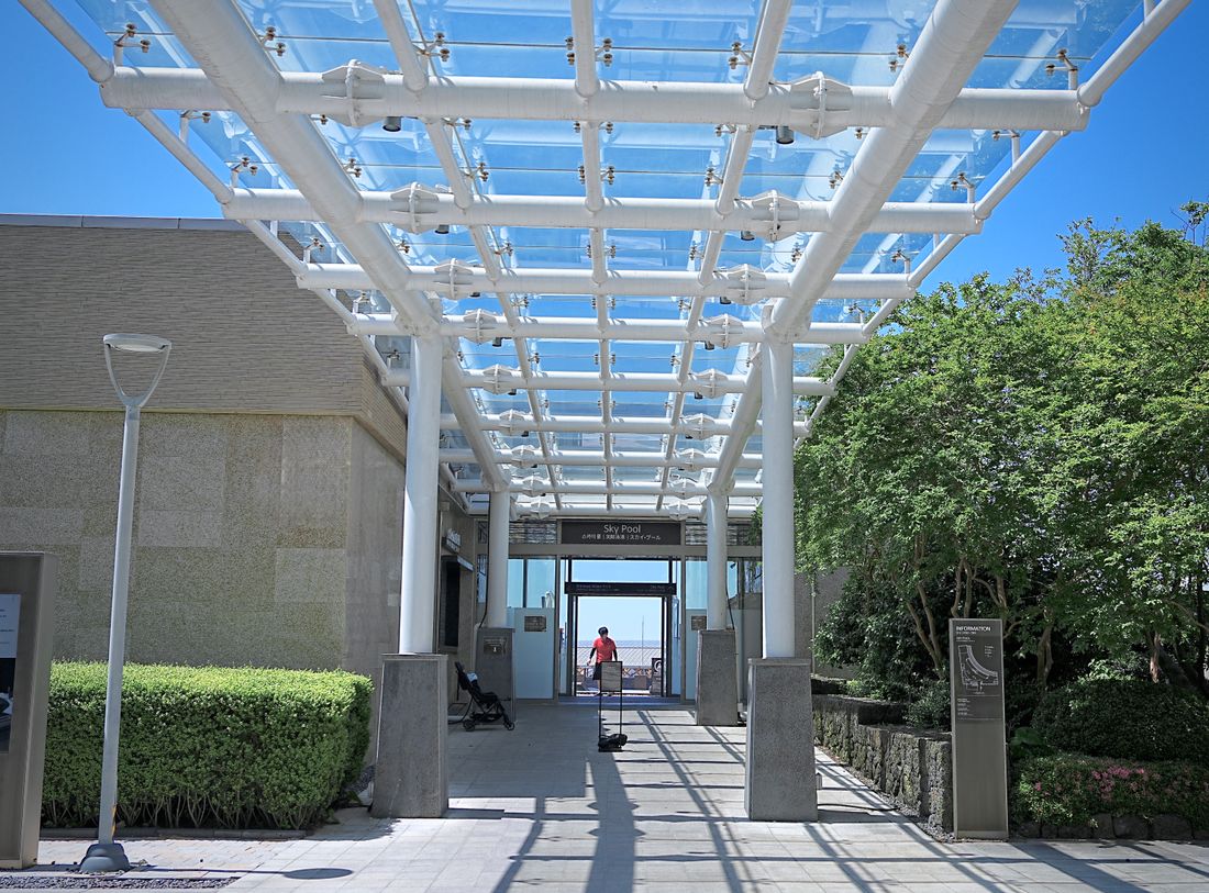 Illustrative glass canopy at a contemporary building entrance