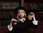 Stylish young woman showing focus with cards