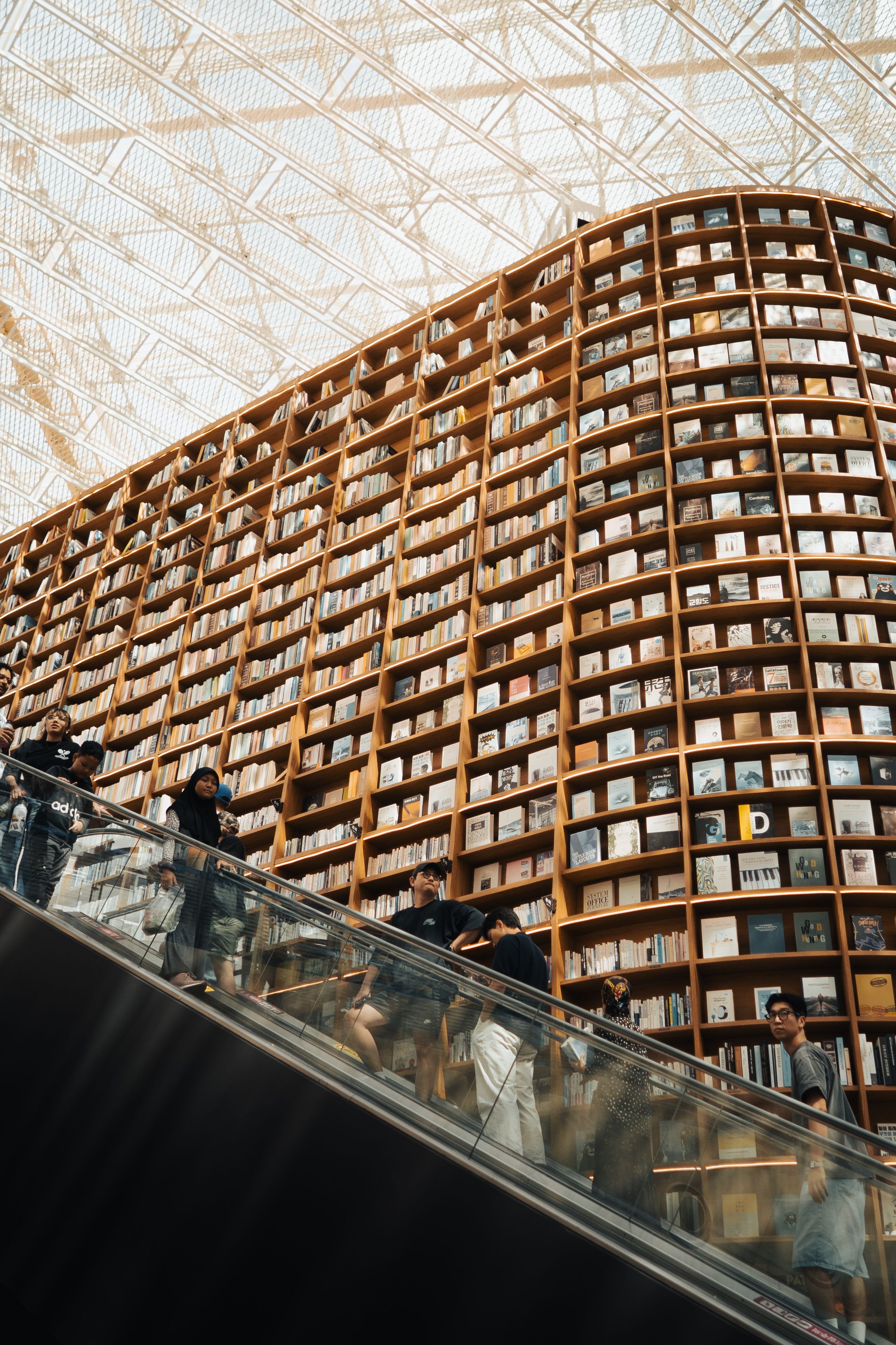 Modern Library with Escalator and Bookshelves · Free Stock Photo
