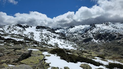 Free Breathtaking view of snowy Sierra de Gredos mountains under a vivid blue sky. Stock Photo