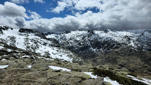 Free Majestic snowy peaks under dramatic clouds in Castile and León, Spain. Stock Photo