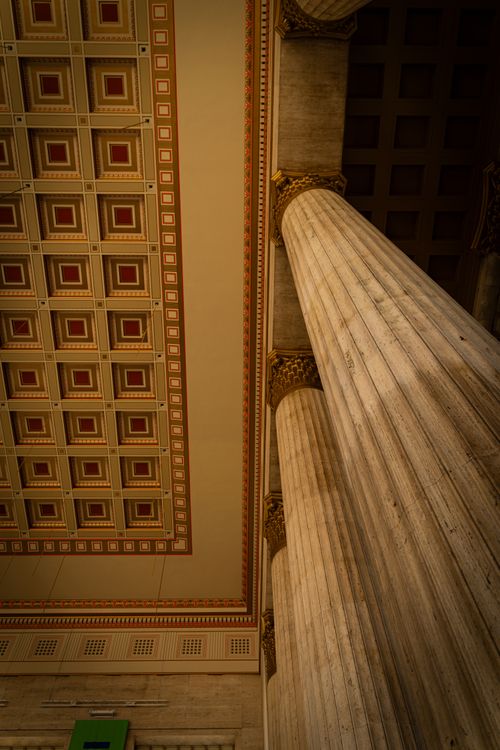 Free Interior view of classic columns and ornate ceiling in Philadelphia's architectural masterpiece. Stock Photo