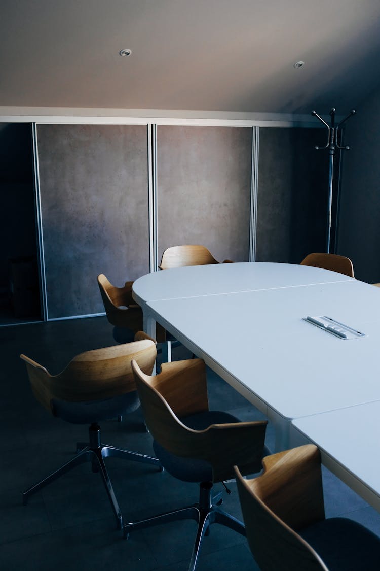 Oval Table And Chairs In Modern Meeting Room