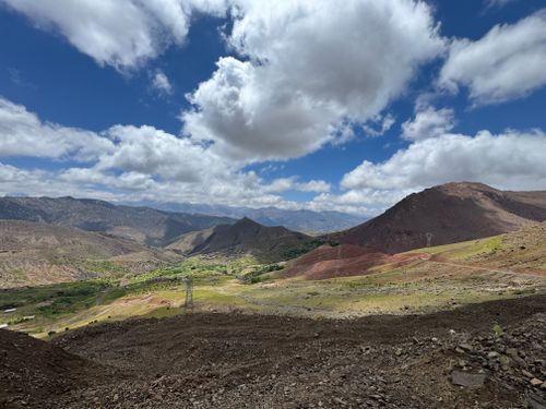 Free Breathtaking landscape of Atlas Mountains with clear skies and fluffy clouds, showcasing nature's beauty. Stock Photo