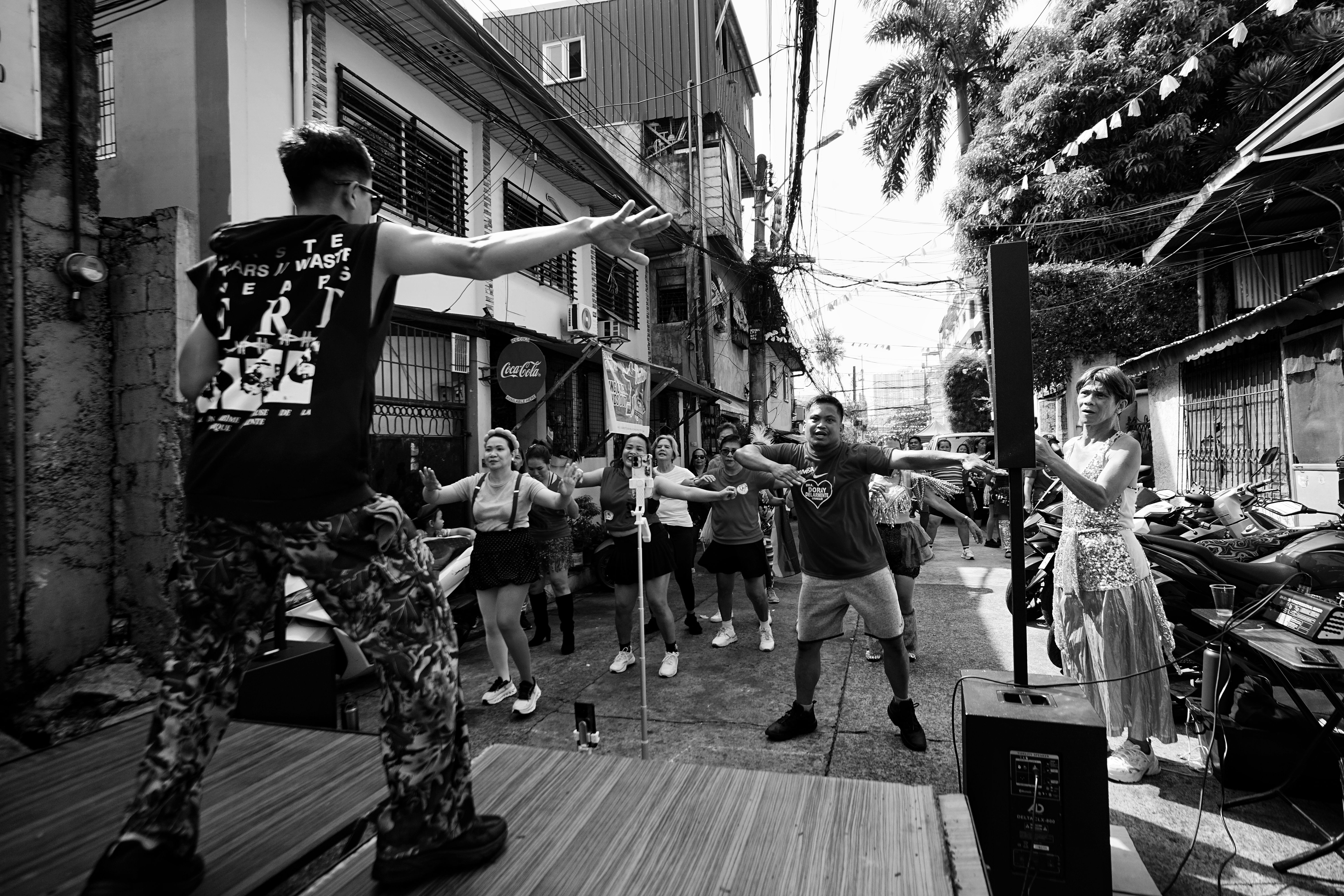 Fitness class during an outdoor event with participants engaged in group activities