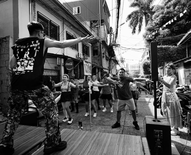 Fitness class during an outdoor event with participants engaged in group activities