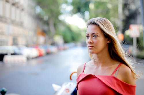 Selective Focus Photo of Woman in Red Top