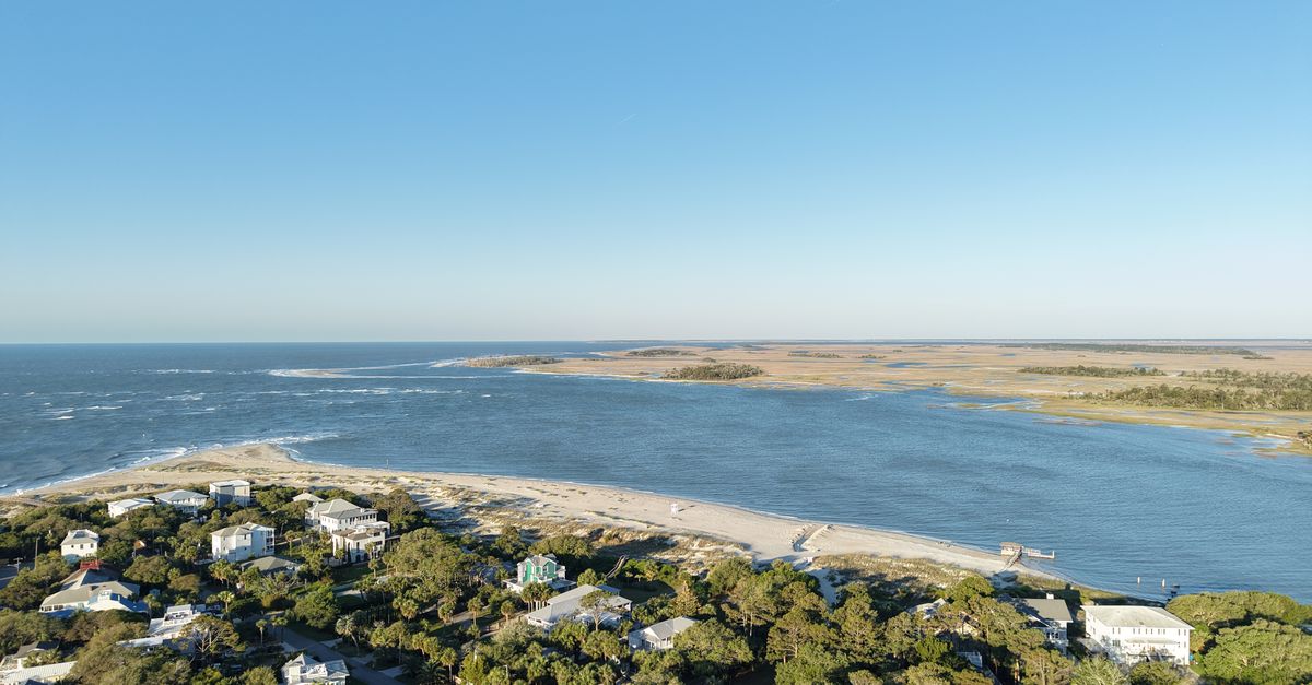 Explore the stunning aerial view of Tybee Island's beachfront and coastal surroundings.