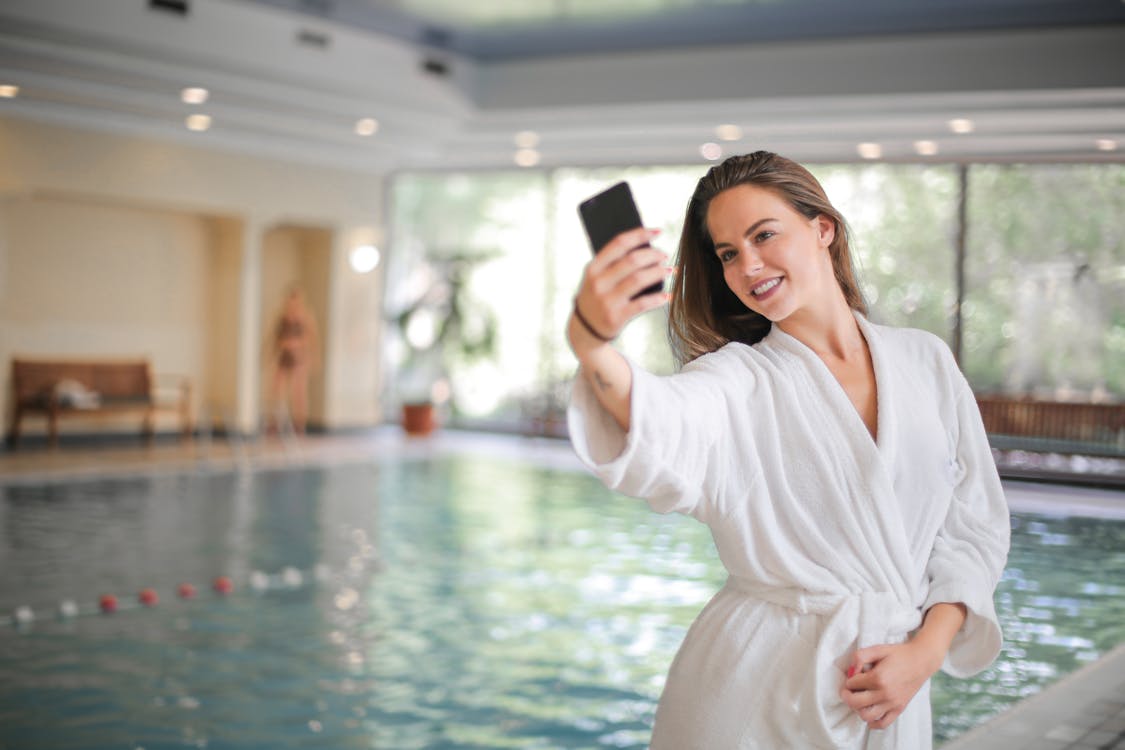 Free Woman Taking Selfie Using Her Smartphone Stock Photo