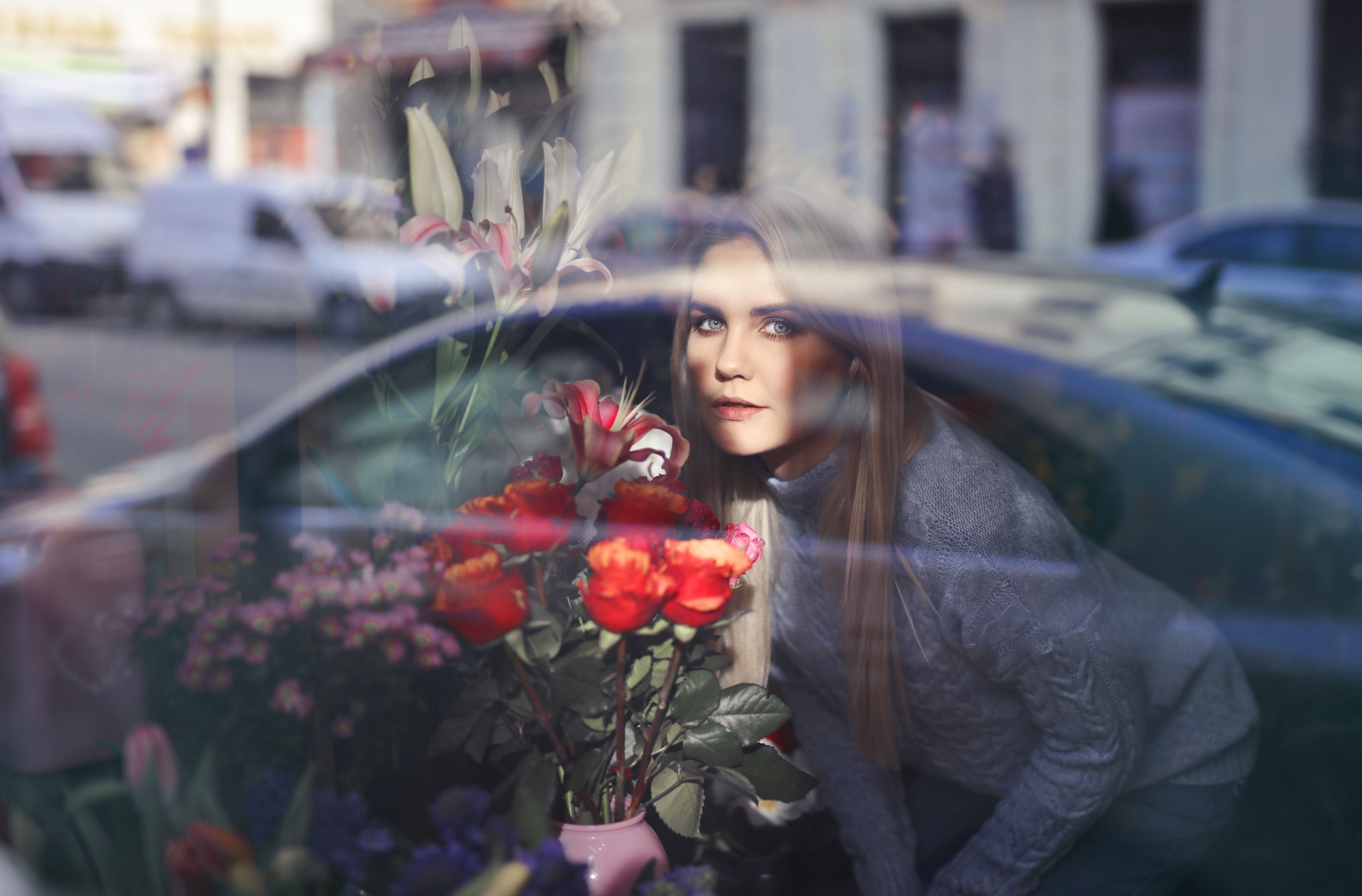 Woman in Gray Long Sleeve Shirt Holding Red Roses · Free Stock Photo
