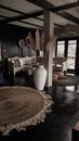 White Ceramic Vase on Brown Wooden Floor
