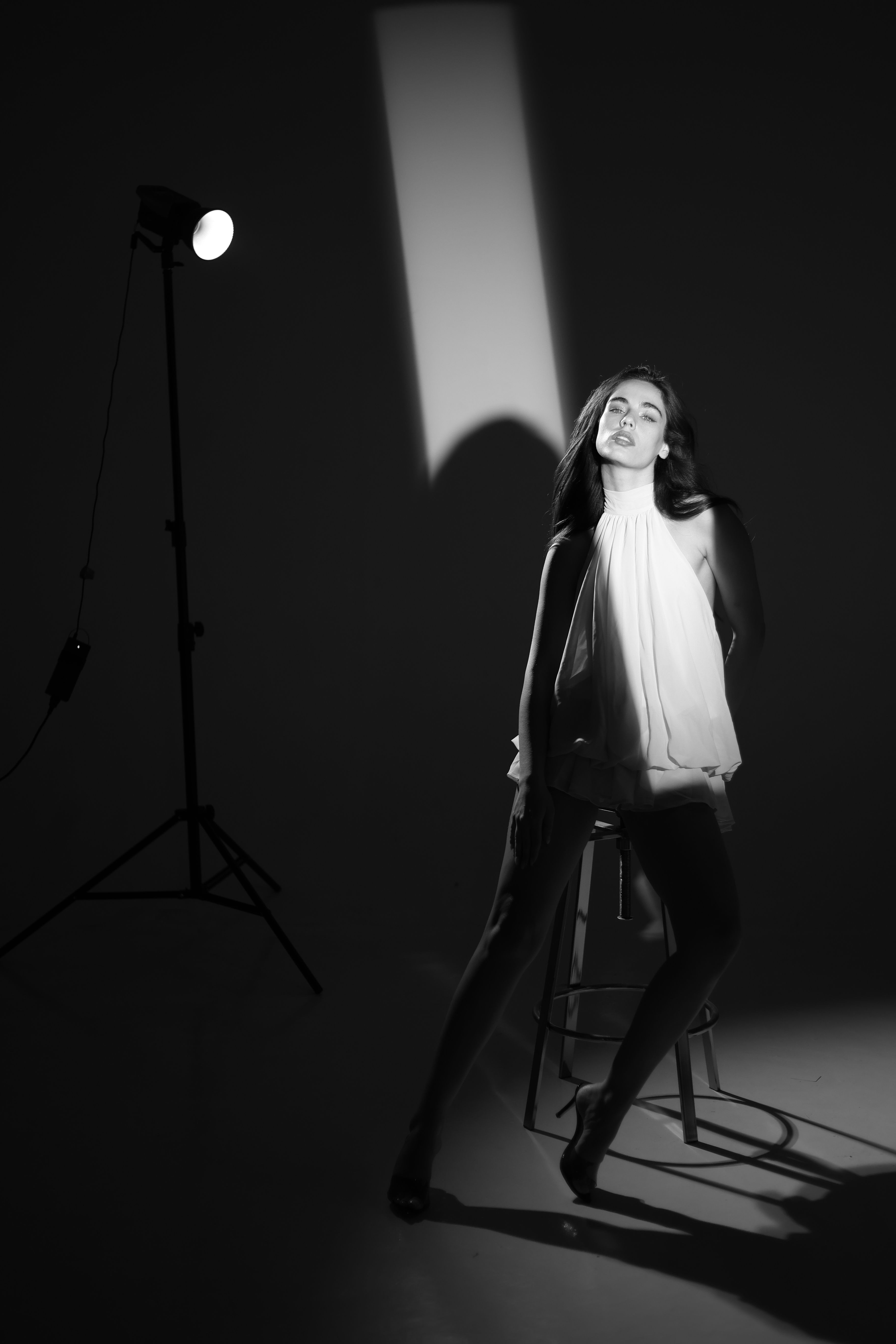 Dramatic Portrait in Monochrome Studio Setting · Free Stock Photo