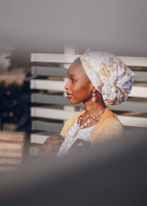 Free Portrait of an African woman wearing traditional Nigerian clothing outdoors, showcasing cultural elegance. Stock Photo