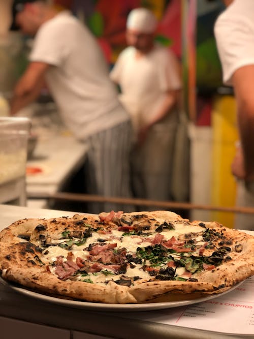 Pizza on Brown Wooden Table