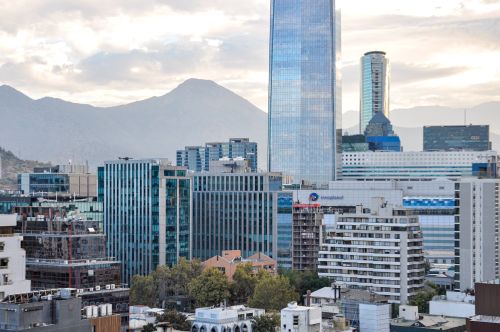 Free Skyline view of Santiago, Chile, showcasing modern skyscrapers and mountainous backdrop. Stock Photo