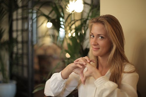 Woman in White Long Sleeve Shirt