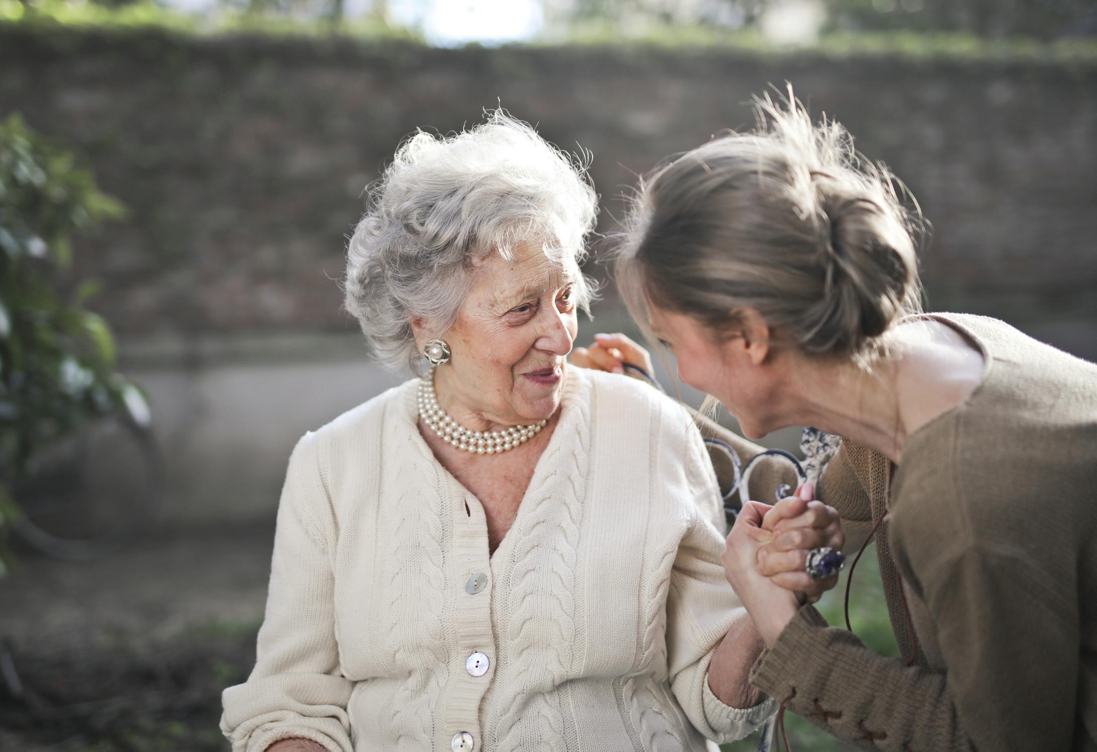 a lady chatting with an elderly lady